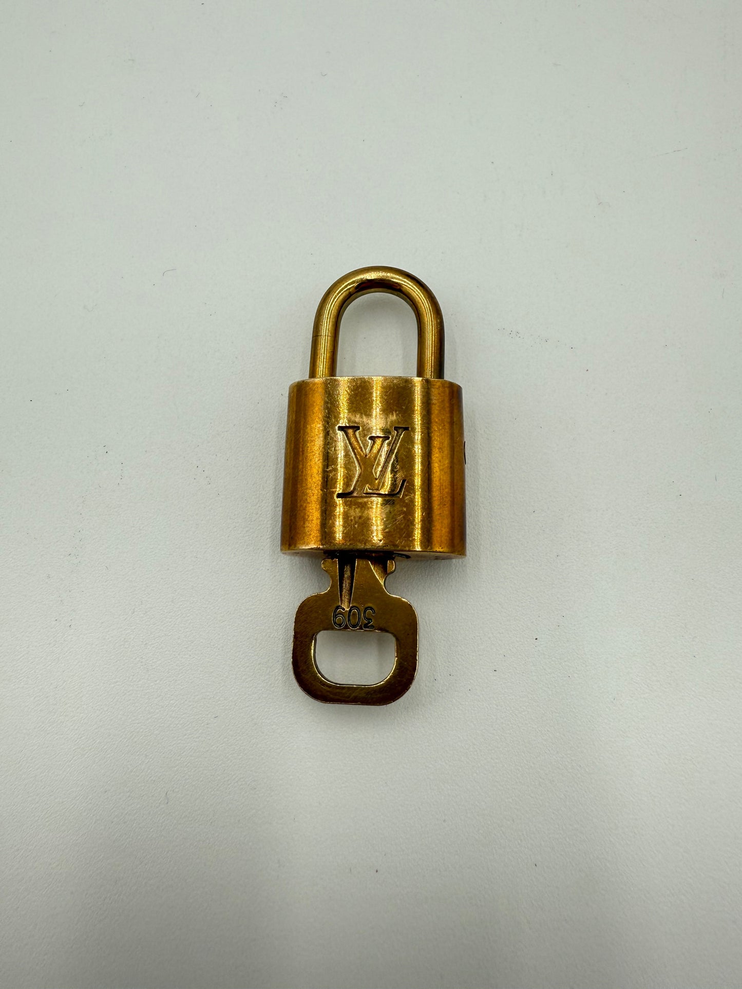 Accessory Luxury Designer Tag By Louis Vuitton In Gold