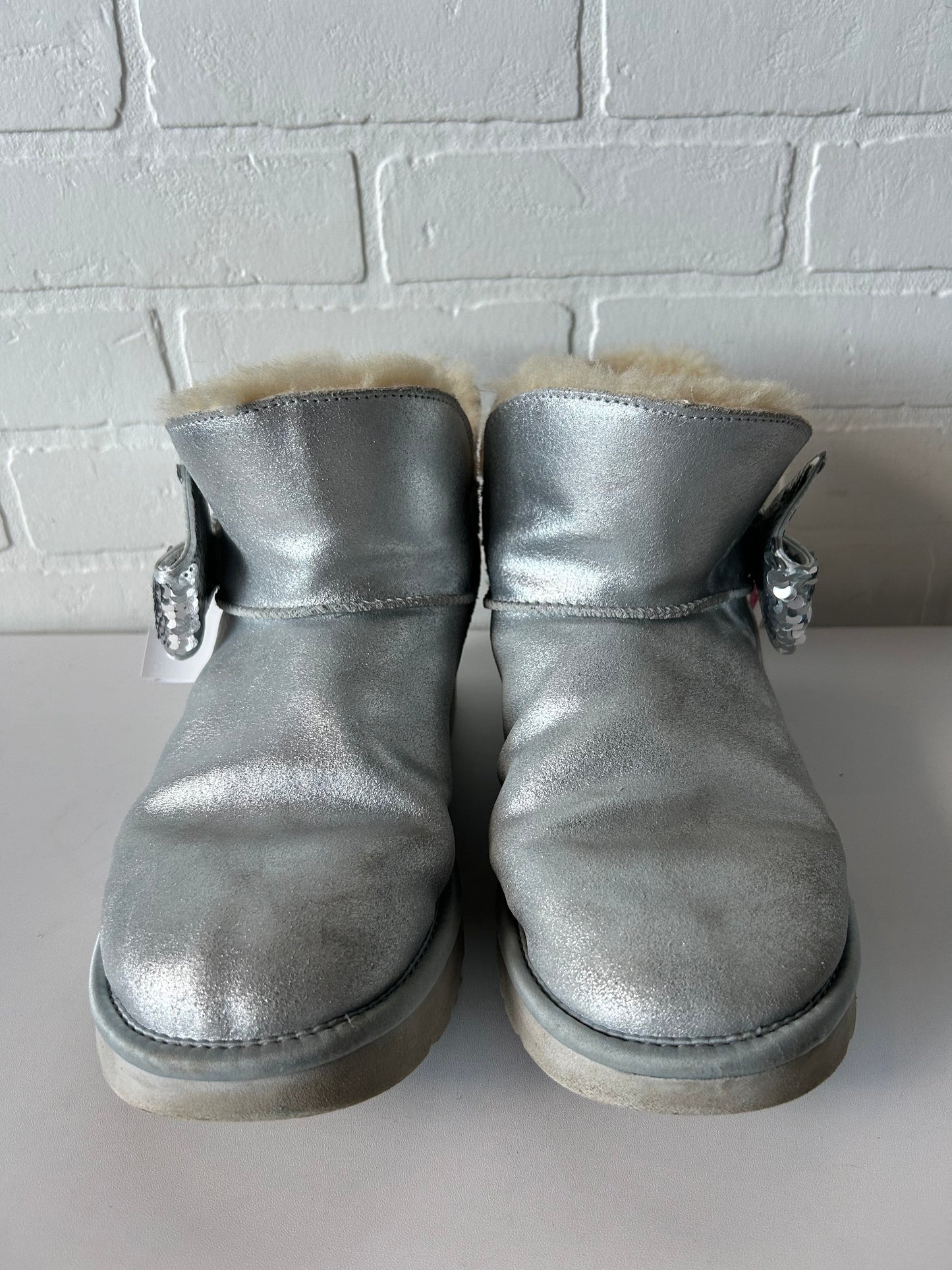 Boots Designer By Ugg In Silver, Size: 9